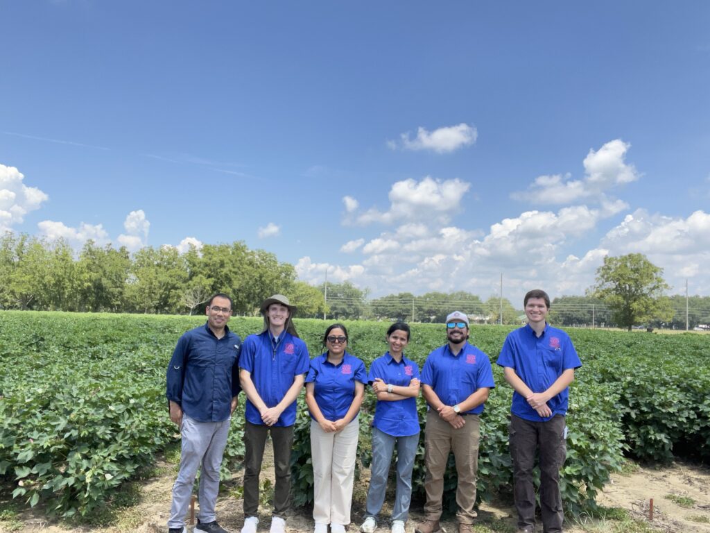 2026 Runner up grant recipient Bisho Lawaju with colleagues in the field.